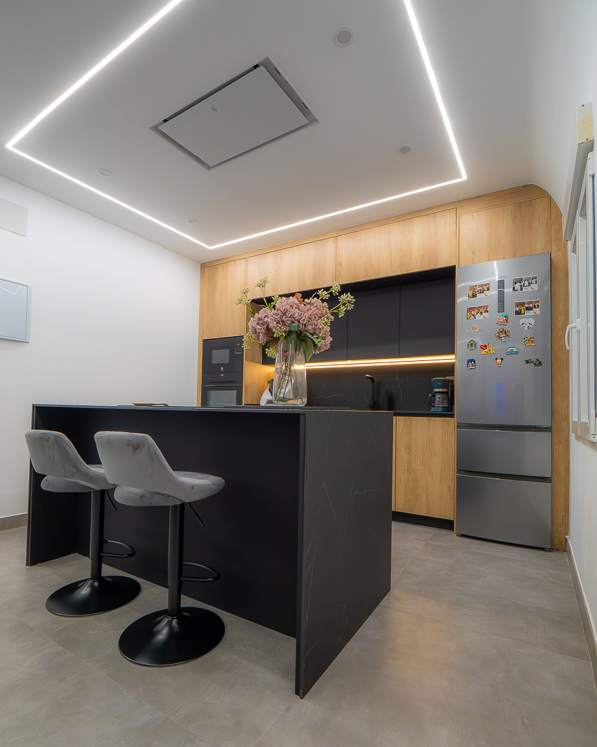 Contemporary kitchen with LED lighting and matte cabinetry
