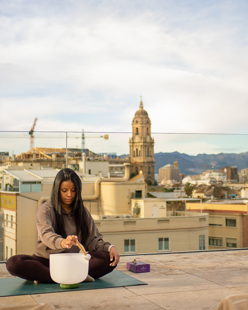 Sound-bowl wellness ritual on a rooftop